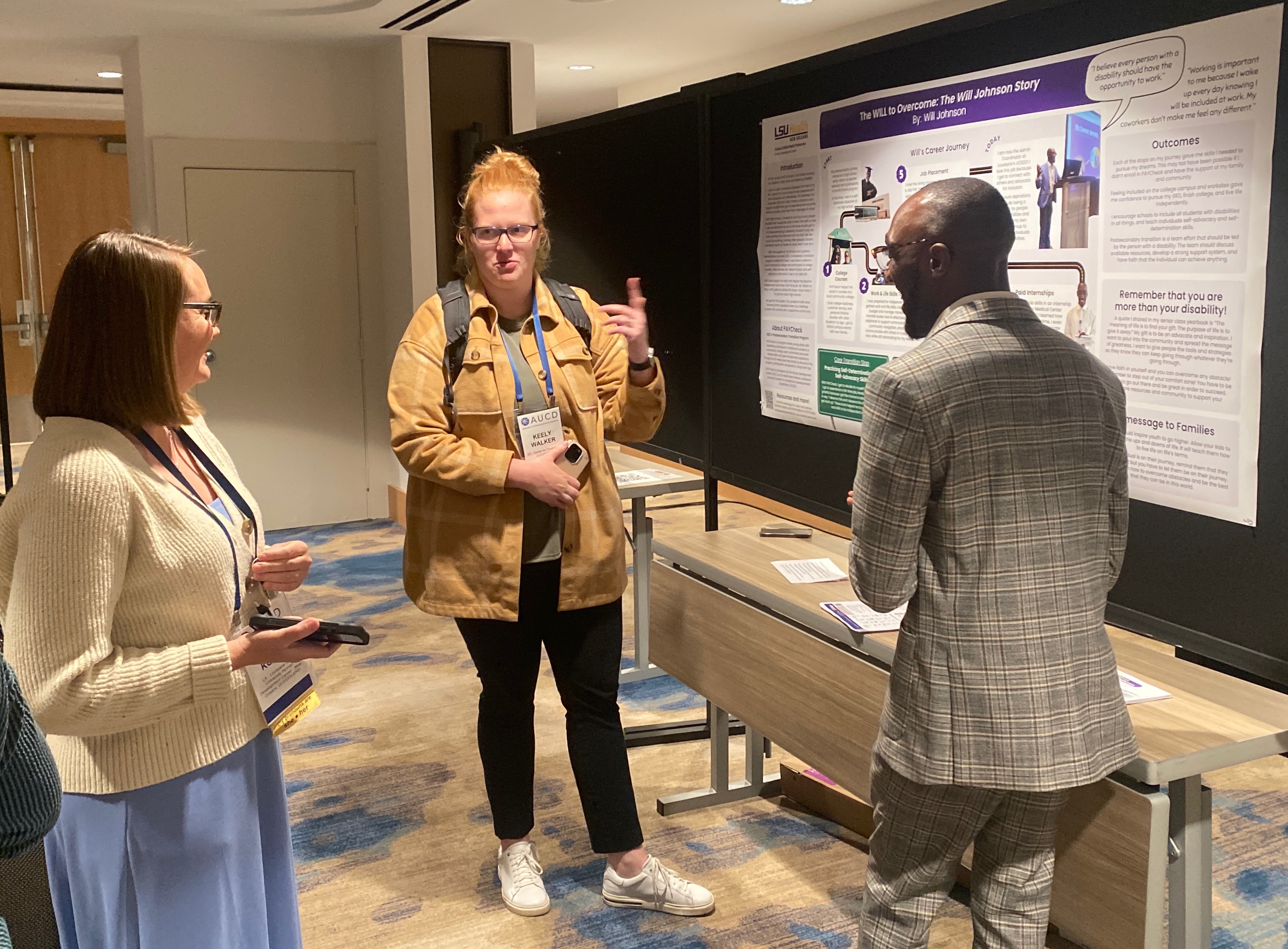 Will Johnson, AUCD Network member from the Louisiana State University Human Development Center, discusses their poster with AUCD 2024 Conference attendees.
